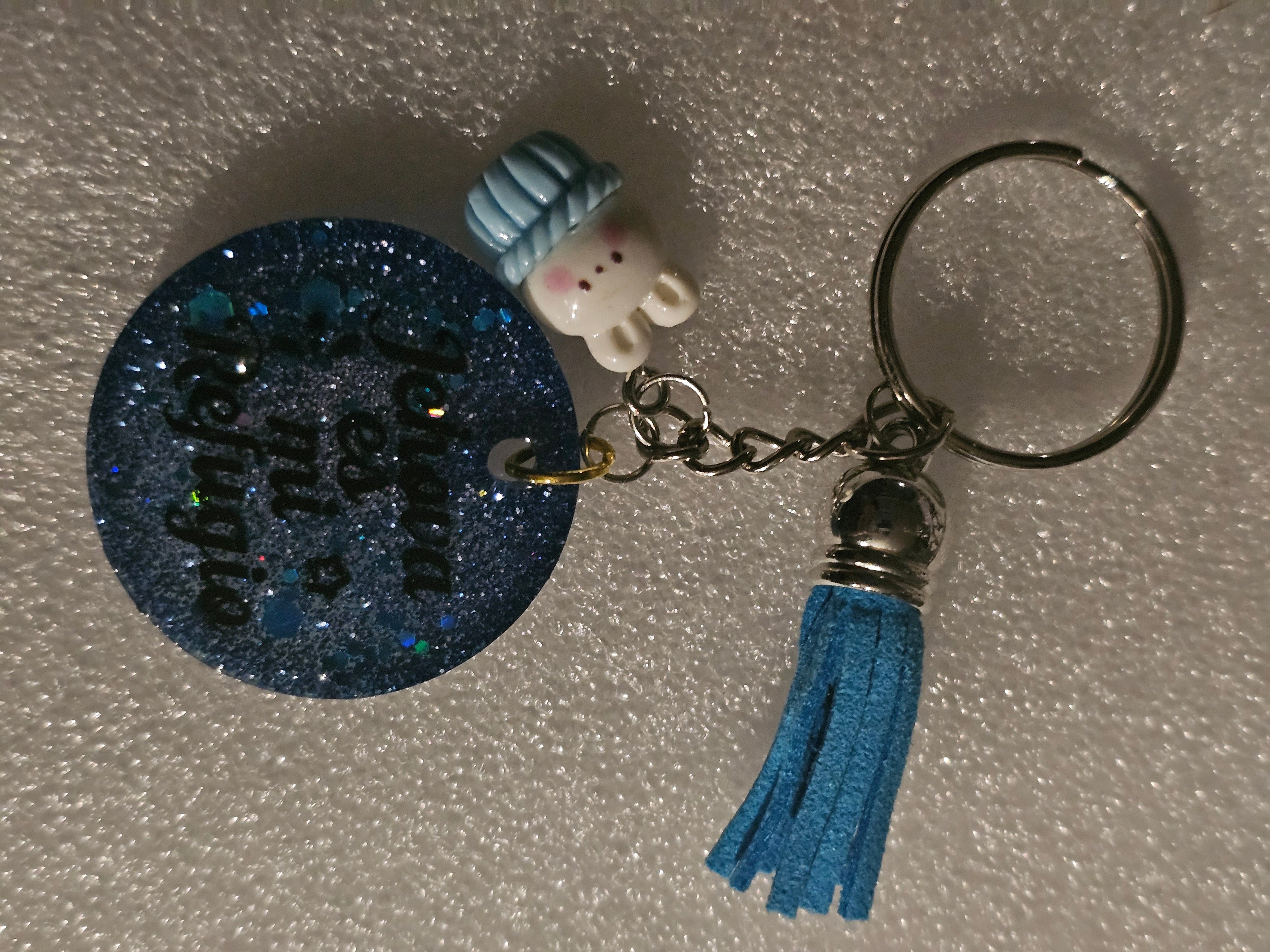 "Dios es mi Refugio" Blue Glitter Resin Keychain – Snowman & Blue Tassel
