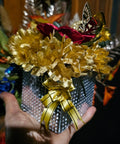 Golden Floral Arrangement with Butterfly